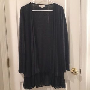 Cardigan with ruffle trim at the bottom